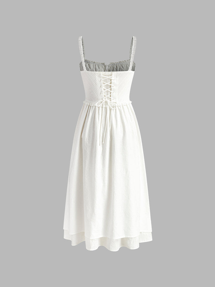 Vacation-ready women's flowing cami midi dress with a charming ruffle hem, perfect for resort wear.