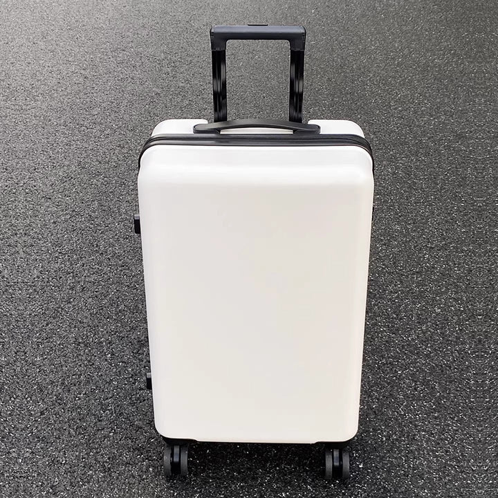 Modern white spinner suitcase, durable hard shell & lightweight design for effortless airport navigation.