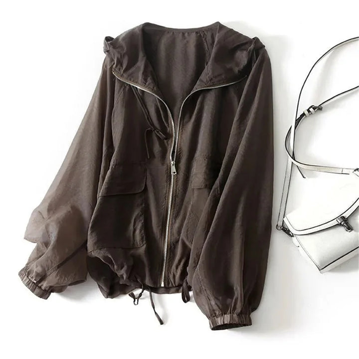 Breathable women's sun protection hoodie for summer outdoor adventures, active beachwear & casual comfort.