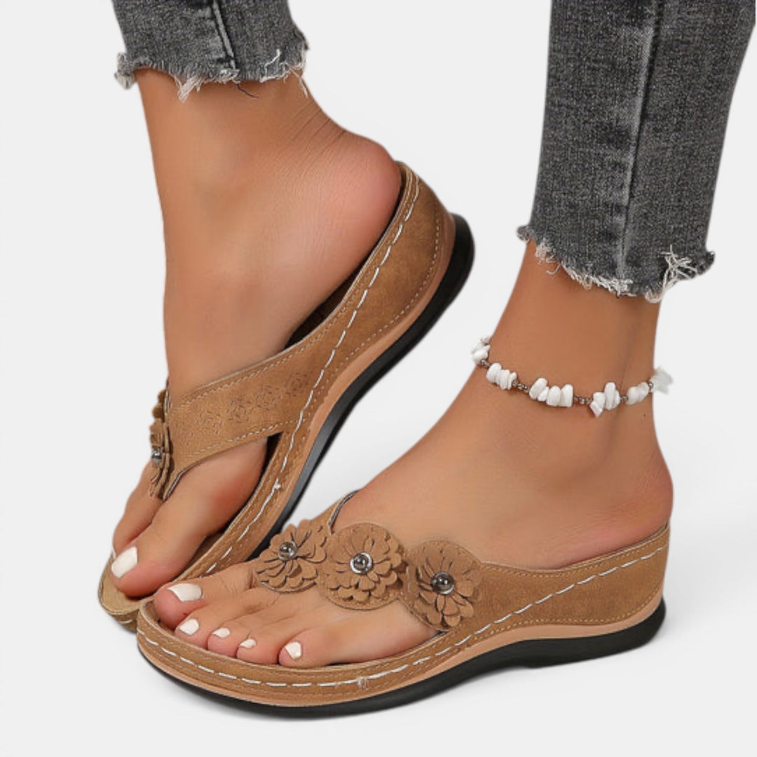Women's comfort walking sandals with a stylish floral design, perfect slip-on footwear for summer vacations.