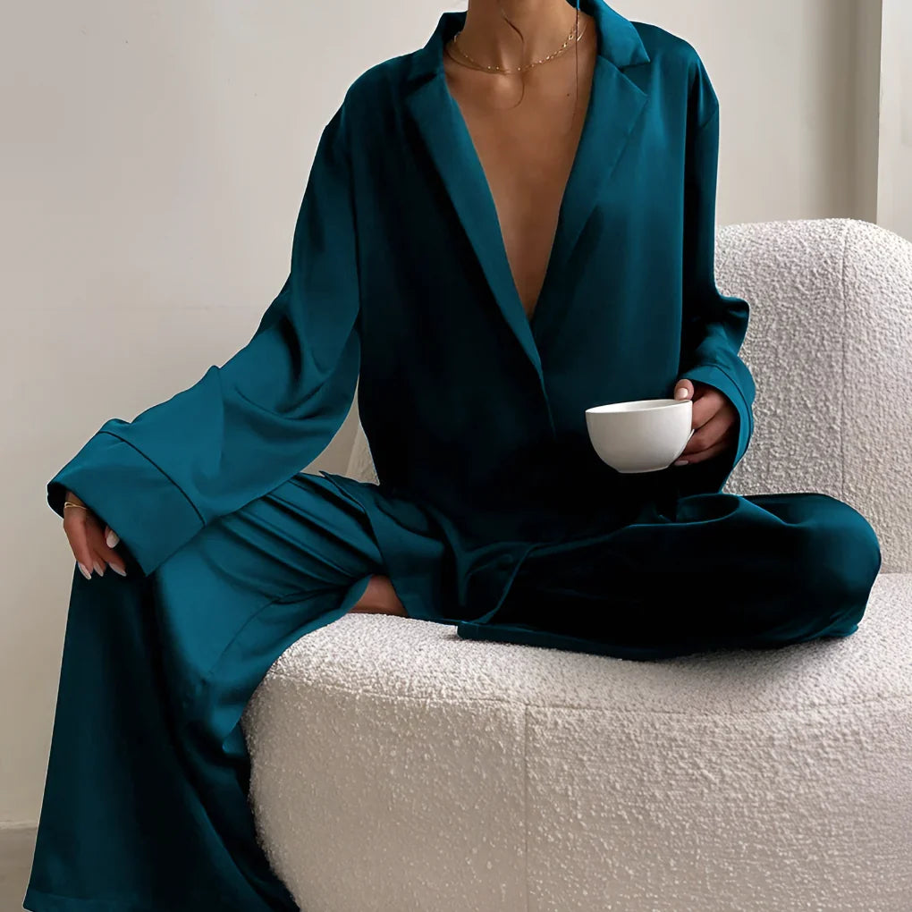 Stylish women's black satin two-piece loungewear set. Soft, relaxed fit sleepwear with wide-leg pants for ultimate comfort.