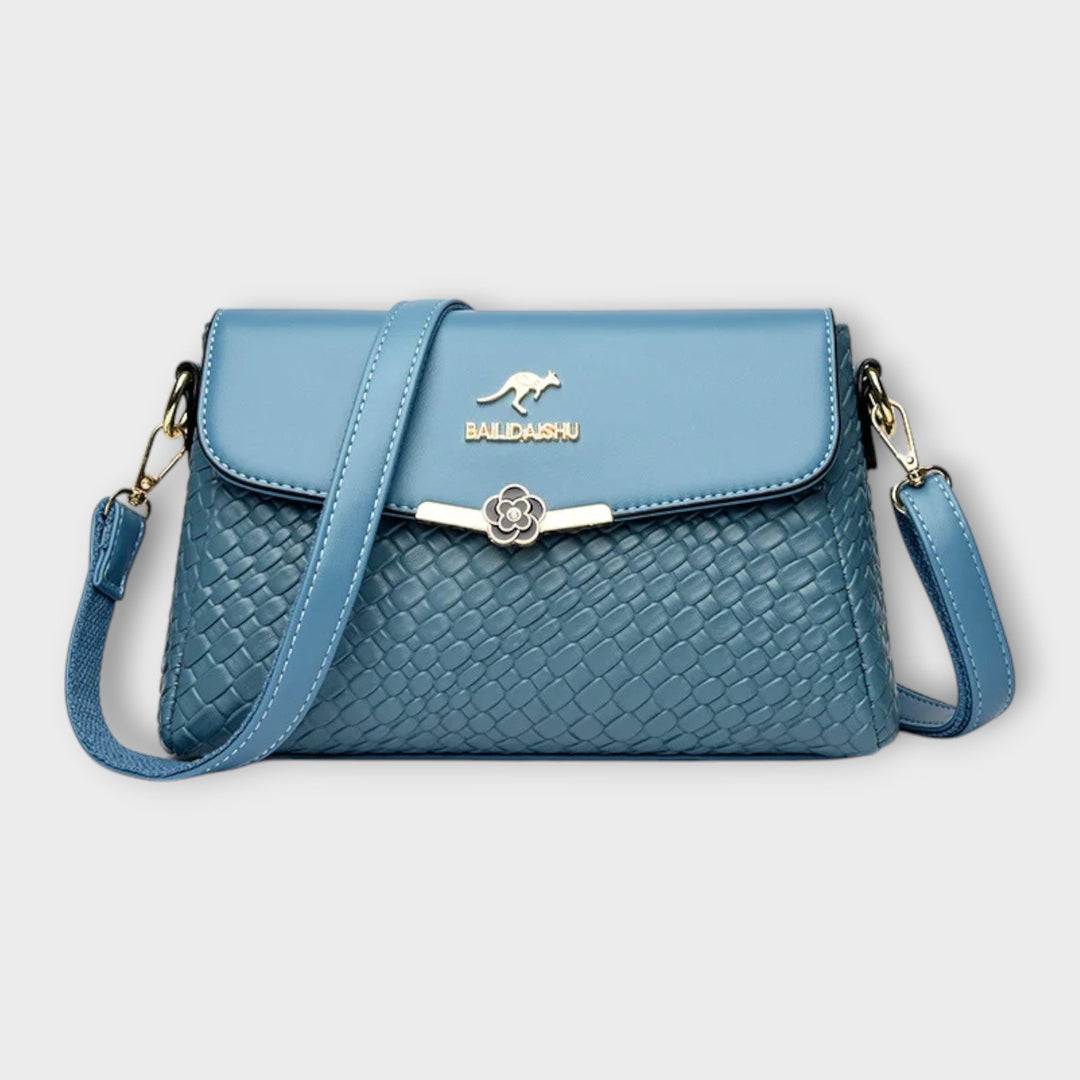 Chic faux leather textured crossbody bag for women. Stylish and elegant shoulder purse, a versatile fashion accessory.