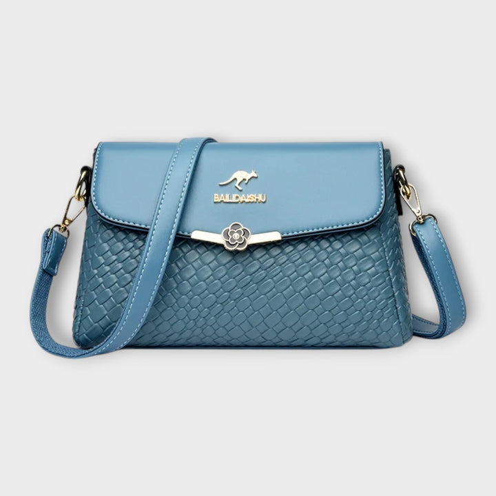 Chic faux leather textured crossbody bag for women. Stylish and elegant shoulder purse, a versatile fashion accessory.