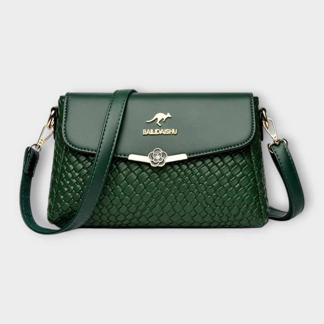 Elegant women's textured faux leather crossbody shoulder bag. Luxurious and stylish purse, a versatile accessory for any outfit.