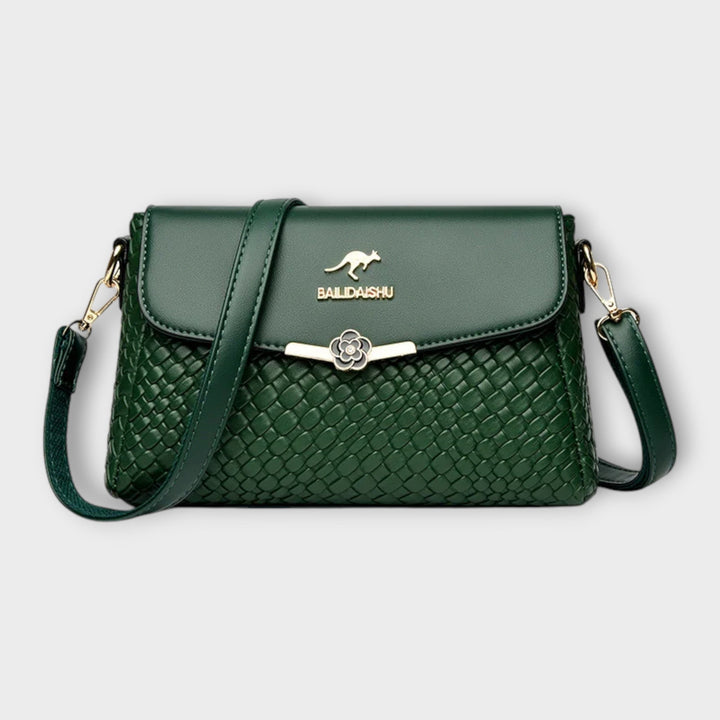 Elegant women's textured faux leather crossbody shoulder bag. Luxurious and stylish purse, a versatile accessory for any outfit.