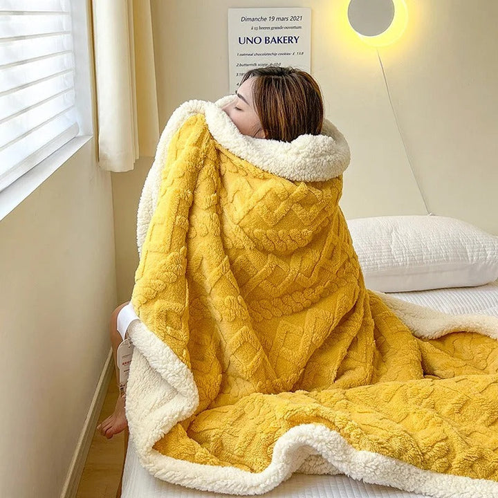 Plush, insulating winter blanket, ideal for snuggling on the couch or as a luxurious bed essential.