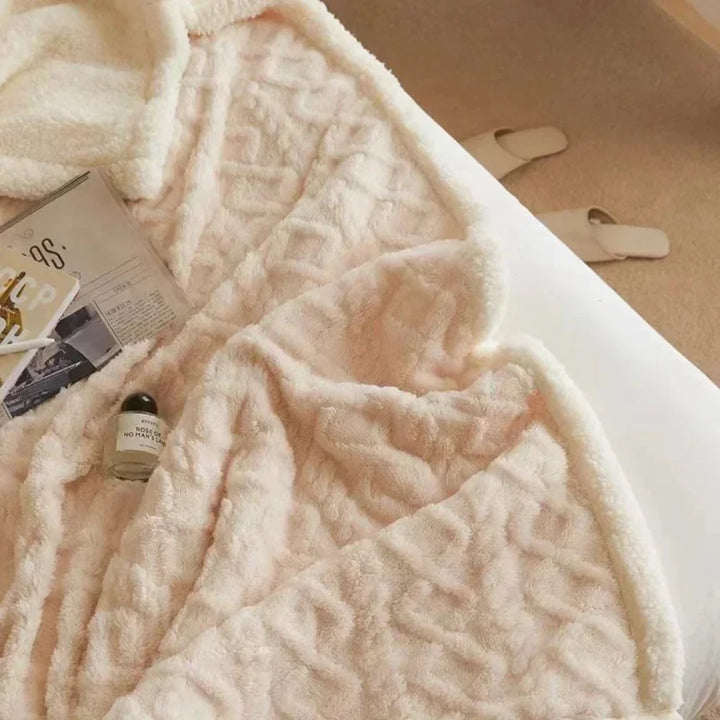 Ultimate warmth with this thick, luxurious winter blanket. A soft, insulating home essential.