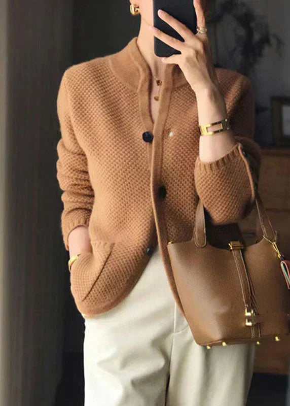 Cosy women's knit cardigan for comfortable layering. Features a stylish design in a versatile beige tone.