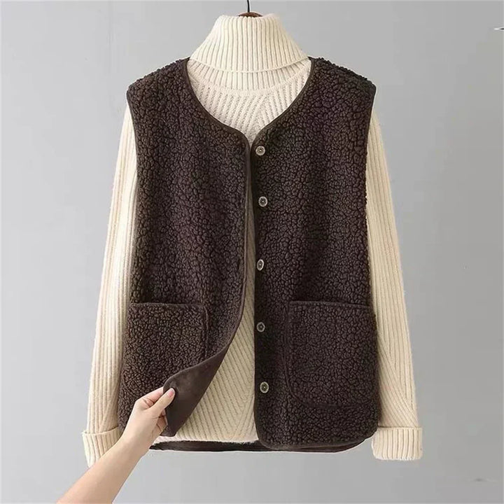 Luxurious women's fleece gilet vest, warm and soft. A stylish button-up layering piece for autumn/winter comfort.