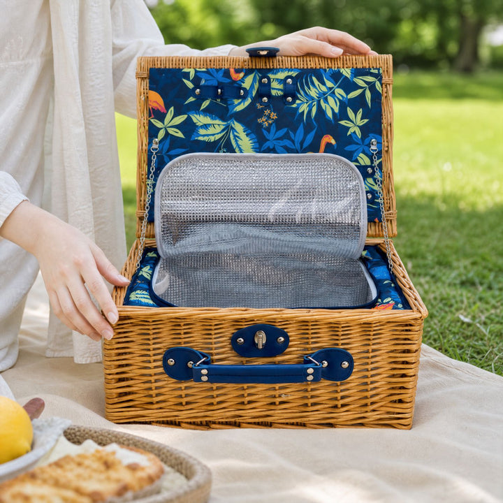 Vintage-style women's picnic basket with modern cooler & full crockery set, blending tradition with convenience.