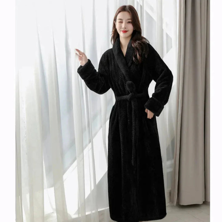 Warm women's winter bathrobe, a soft hooded plush robe providing ultimate comfort and coziness for cold evenings.