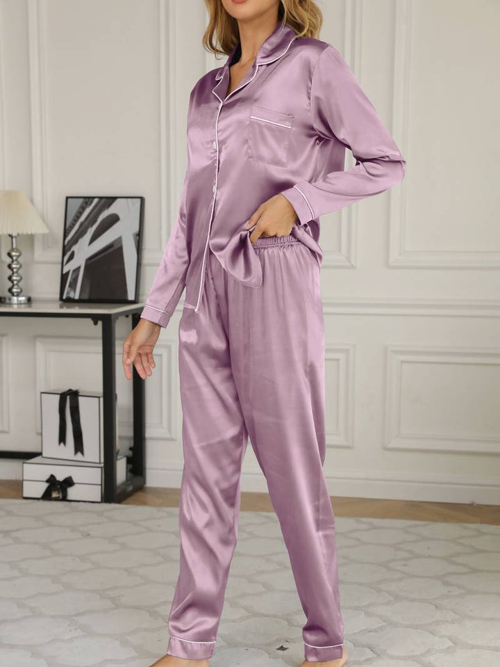 Front view of the women's button-front satin pyjama top, part of an elegant loungewear set.
