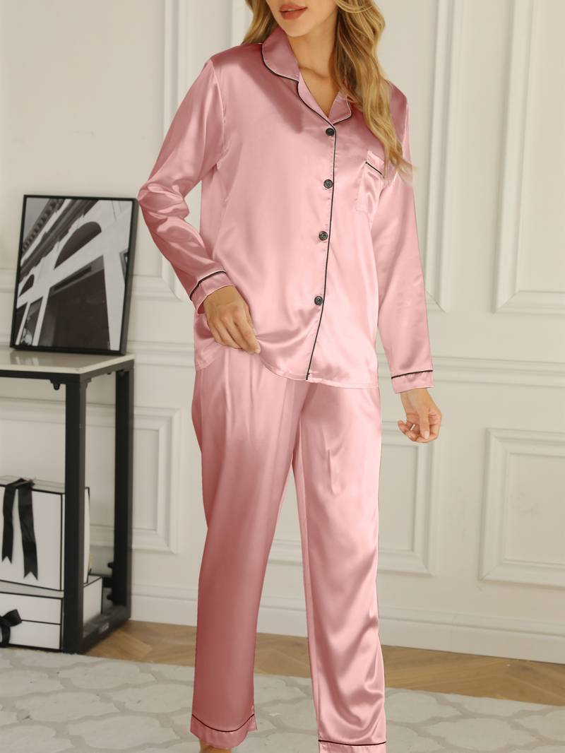 Folded women's satin pyjama set, highlighting the luxurious silky fabric and classic design.
