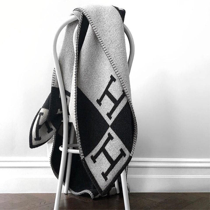 Cozy decorative wool-cashmere blanket, enhancing your living room with elegant warmth.
