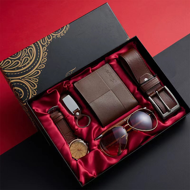 Luxury men's executive gift set with watch, leather belt, portfolio, pen, keychain & glasses for professionals.