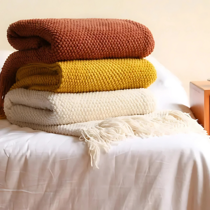 Comfortable merino-style bedroom blanket, soft acrylic throw with tassels for a chic and cozy home.