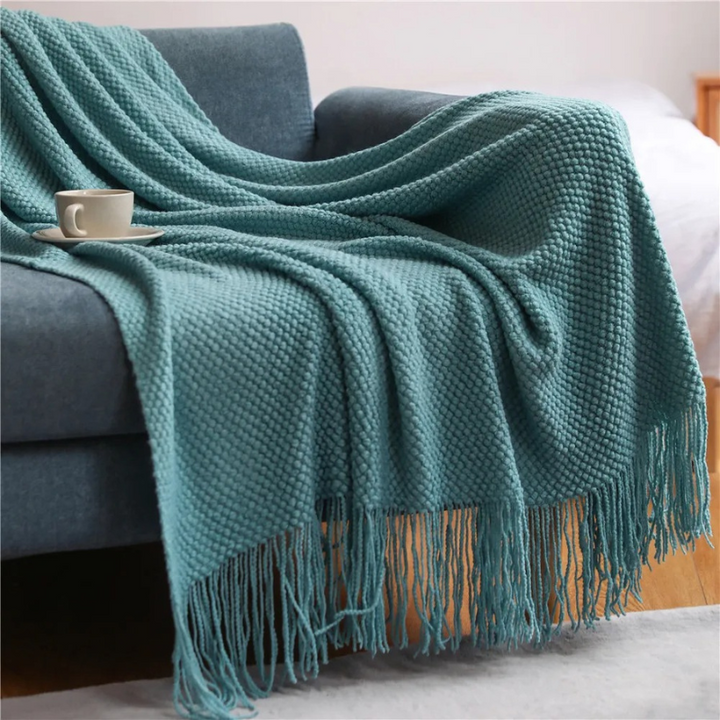 Luxury merino-style blanket, a soft and elegant acrylic throw with tassels for versatile home decor.