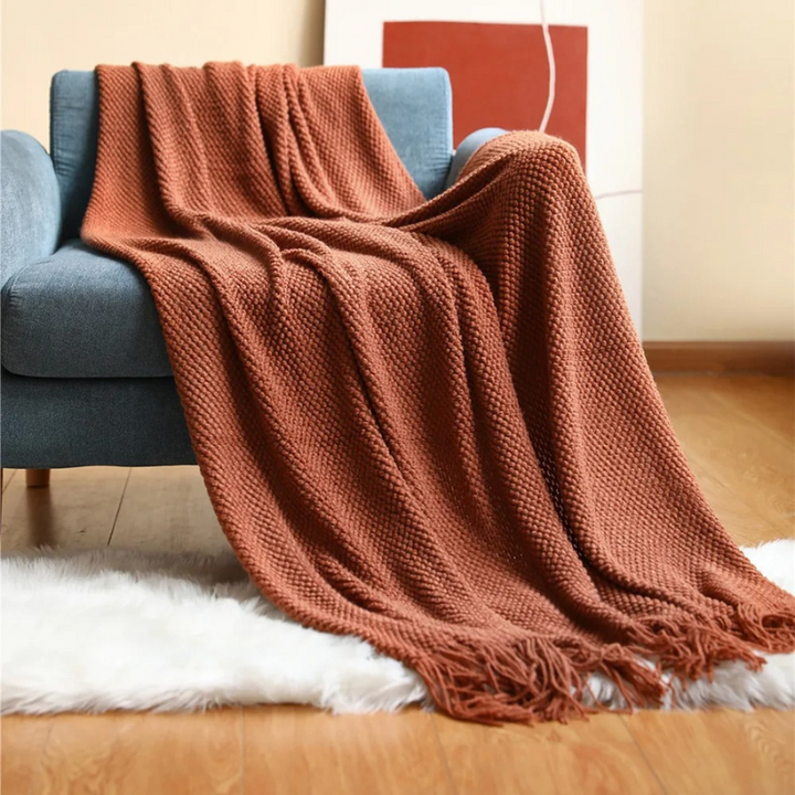 Stylish merino-style home decor blanket, soft acrylic throw with decorative tassels for a modern touch.