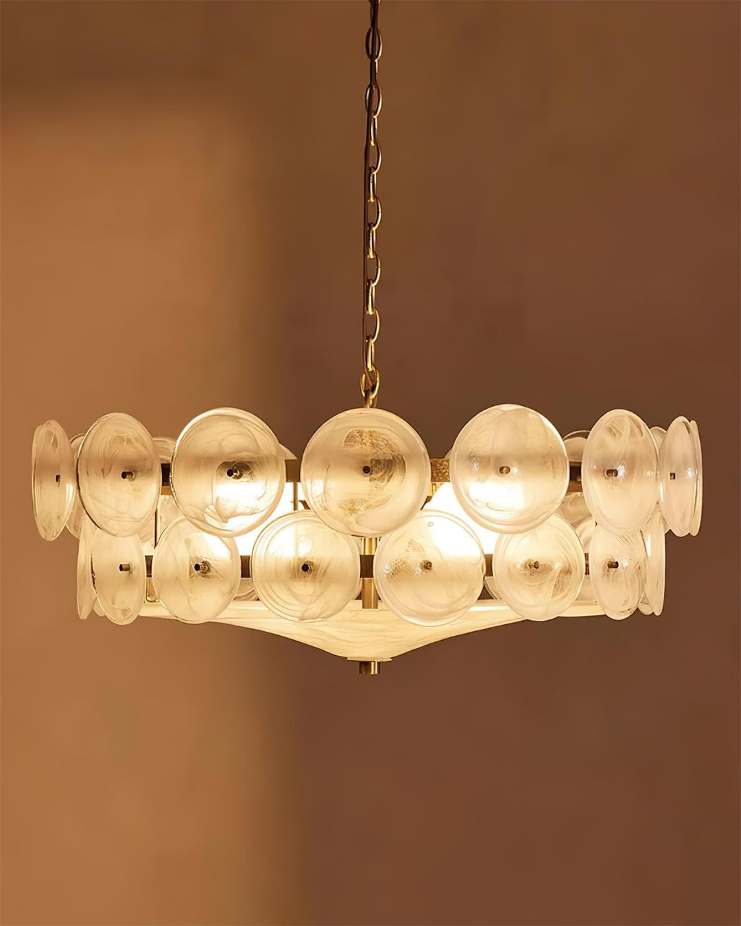 Opulent round glass chandelier, bringing modern elegance to any room.