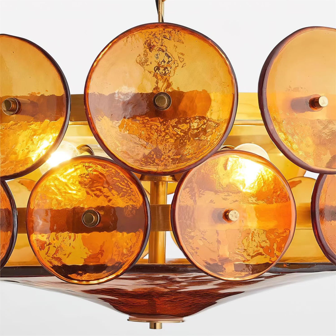 Sophisticated round chandelier, blend of glass, metal, and luxury.