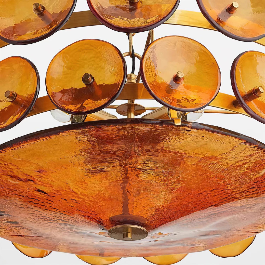 Elegant orange glass round chandelier, modern lighting for upscale homes.