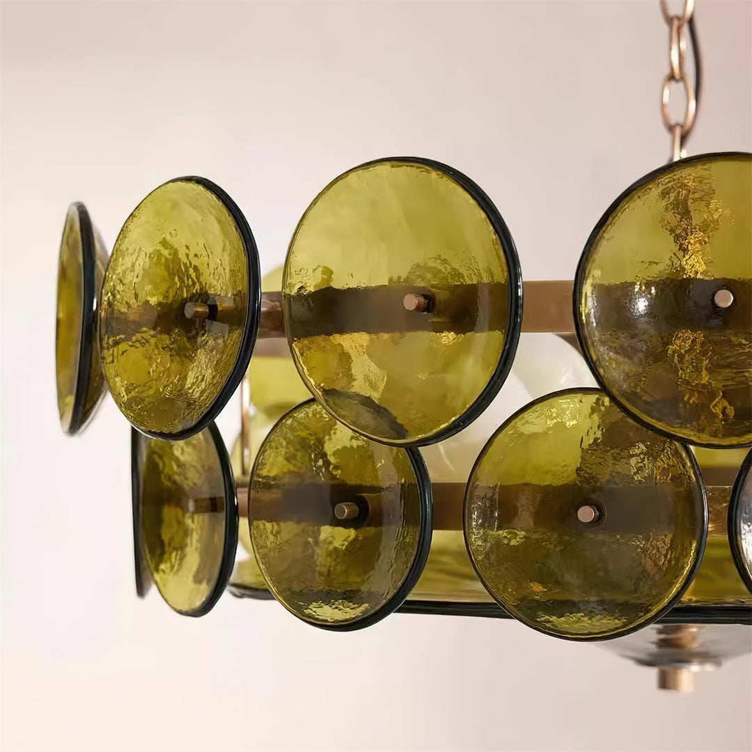 Large round chandelier featuring glass & metal, luxury lighting for entryways.