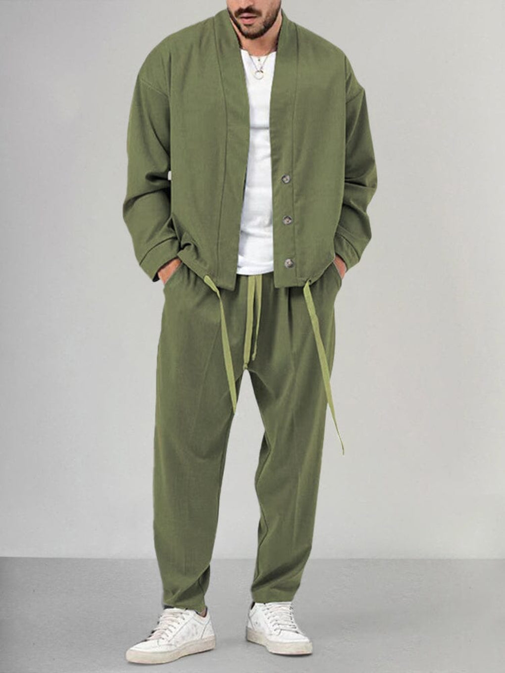 Man in comfortable grey men's relaxed fit 2-piece knit lounge set, perfect for casual wear & ultimate comfort.