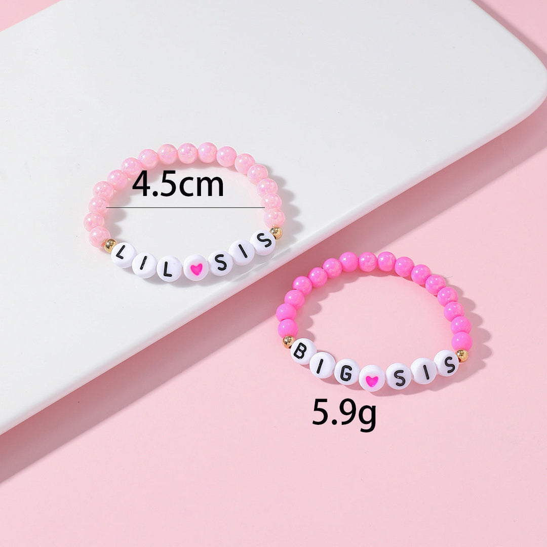 Friendship bracelet matching set, two beaded bracelets with delicate heart charms. Relationship jewelry for friends.