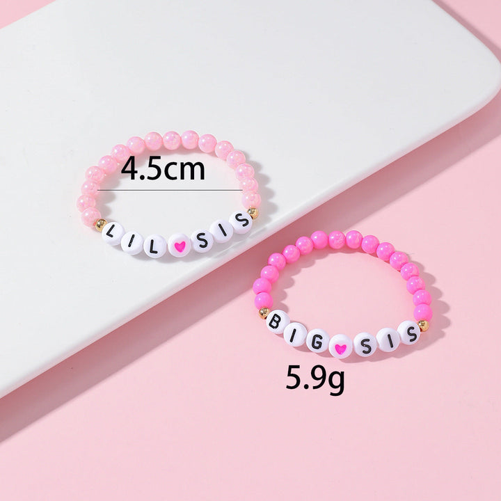Friendship bracelet matching set, two beaded bracelets with delicate heart charms. Relationship jewelry for friends.