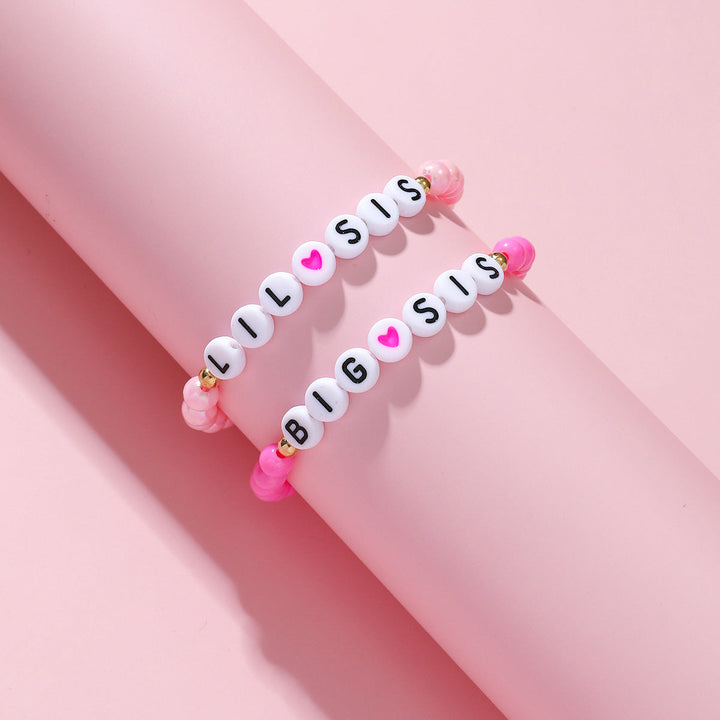 Sister & friend charm bracelet set, matching beaded design. Elastic and adjustable friendship jewelry gift.