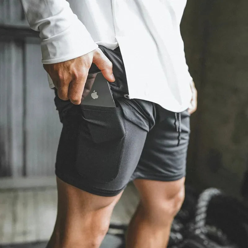 Athletic men's 2-in-1 shorts with built-in compression for running, gym & training. Ultimate comfort.