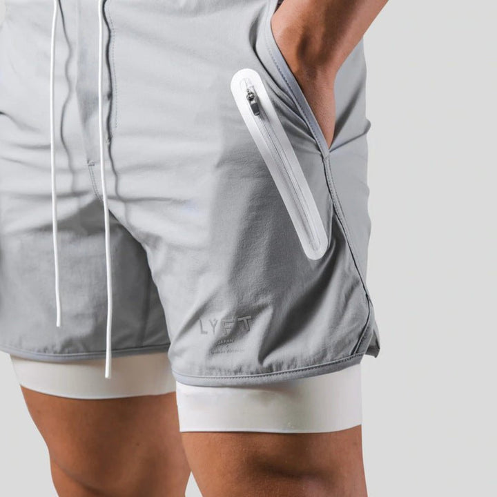 Black men's gym shorts, 2-in-1 with integrated compression for ultimate comfort & performance.