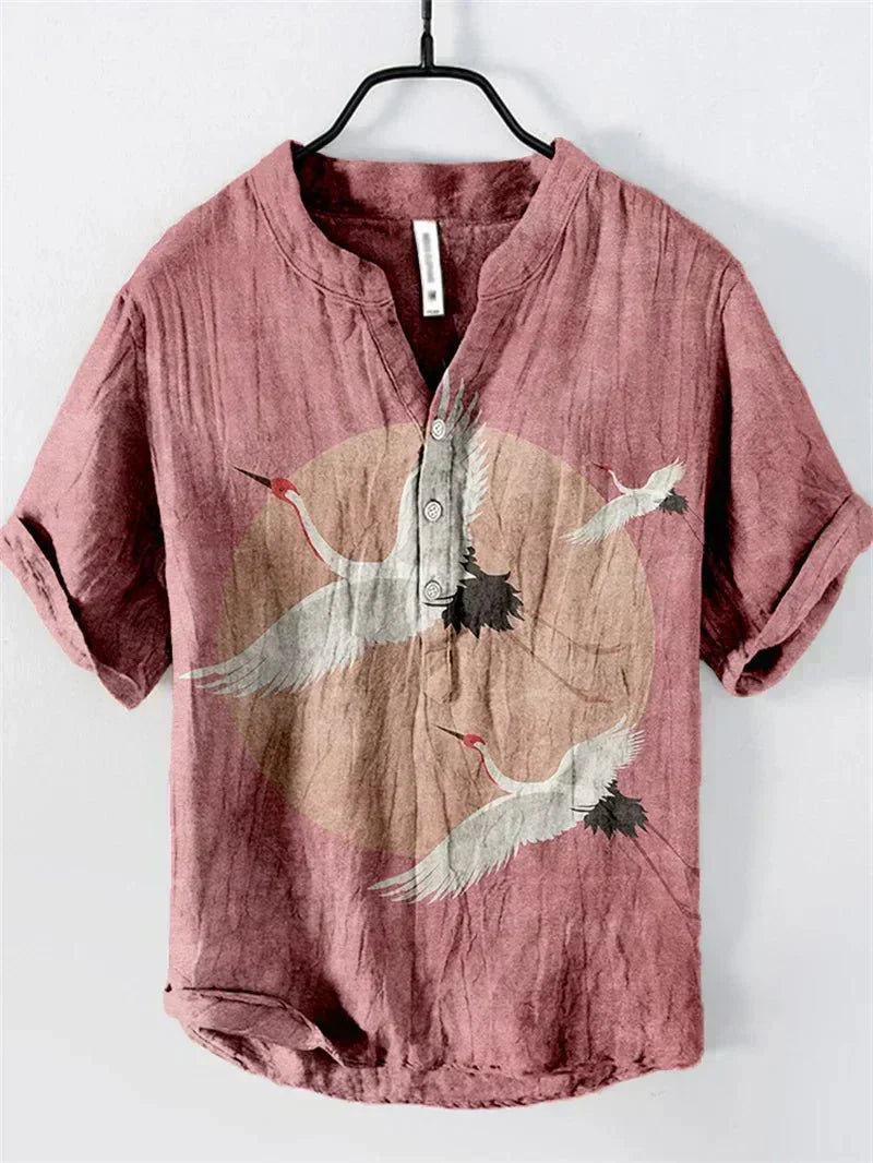 Relaxed fit men's summer shirt with unique artistic print, short sleeves & button-up design. Ideal holiday wear.