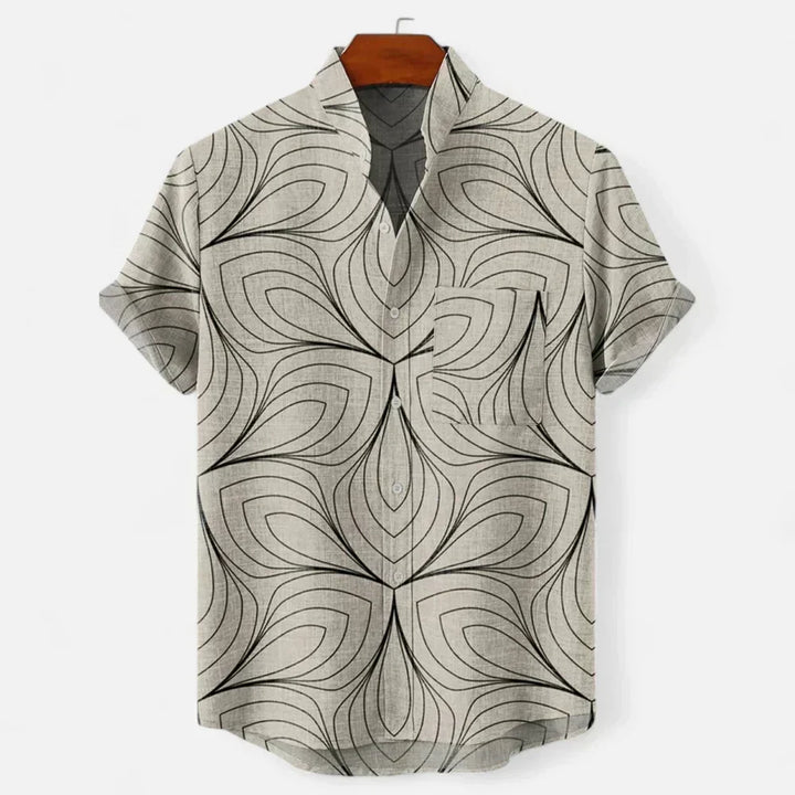 Relaxed fit men's short sleeve shirt with vibrant artistic print, ideal for summer fashion & resort wear.
