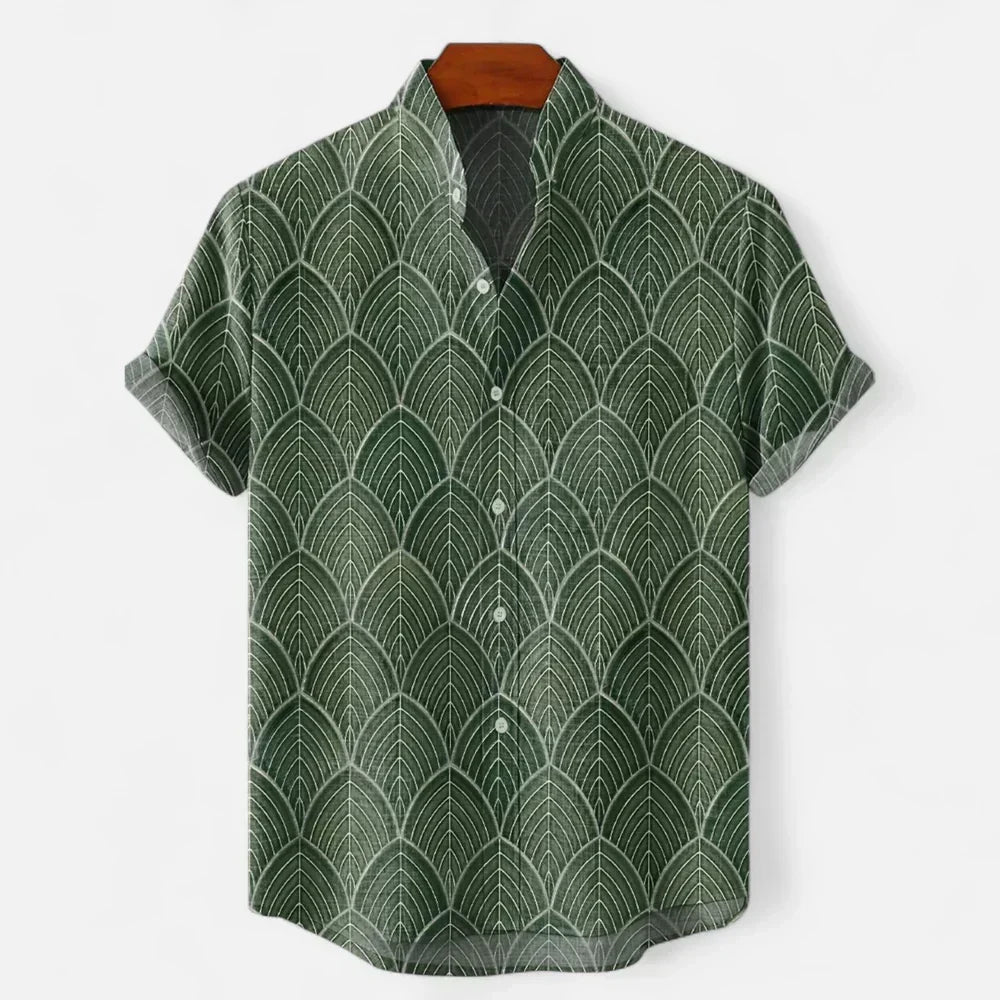 Man wearing a relaxed fit artistic print short sleeve shirt, perfect for casual summer and holiday style.