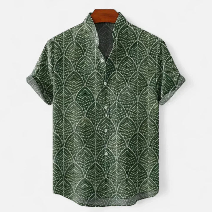 Man wearing a relaxed fit artistic print short sleeve shirt, perfect for casual summer and holiday style.