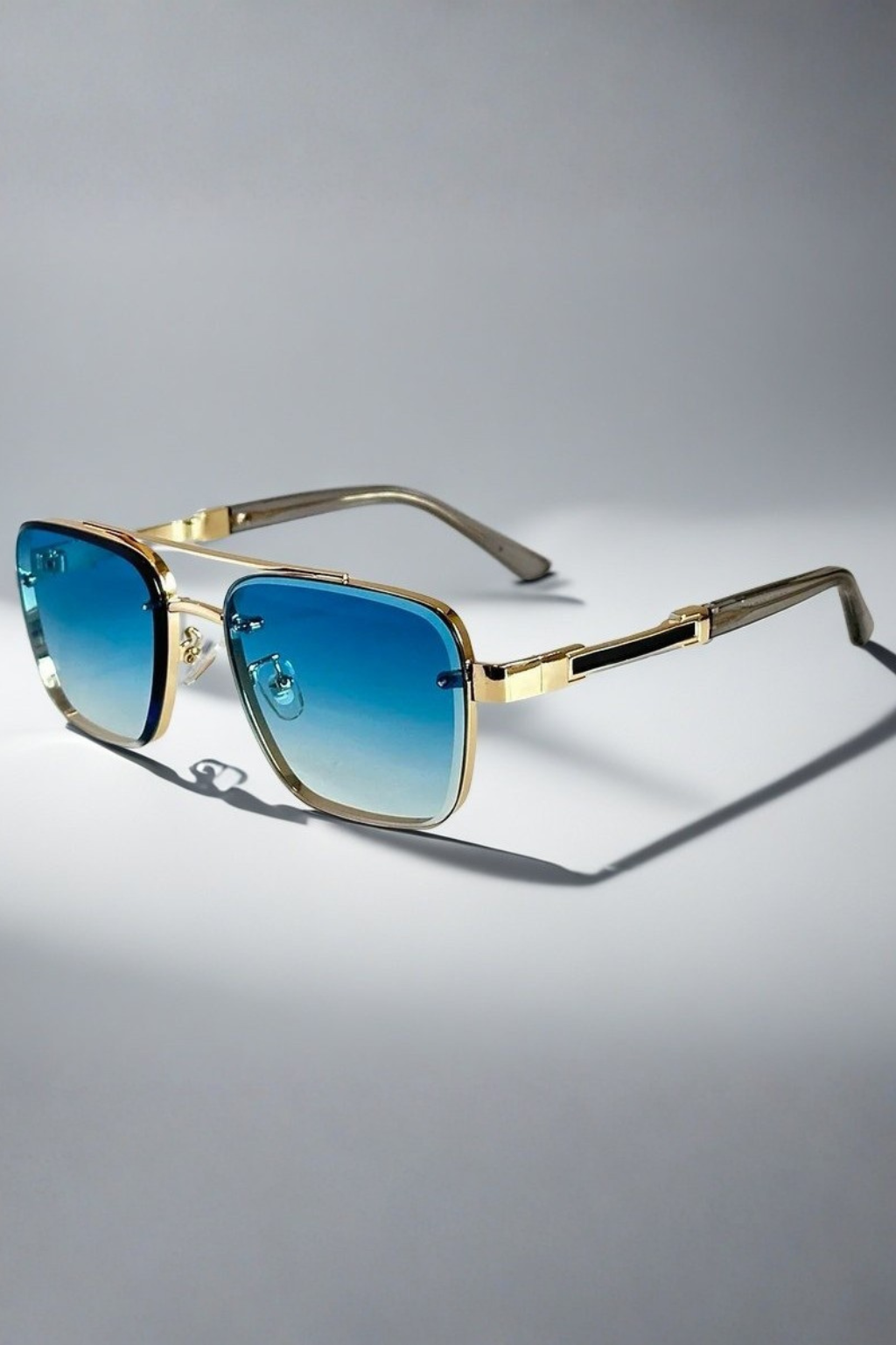 Classic square aviator sunglasses for men. Features a polished gold frame and stylish gradient lenses.