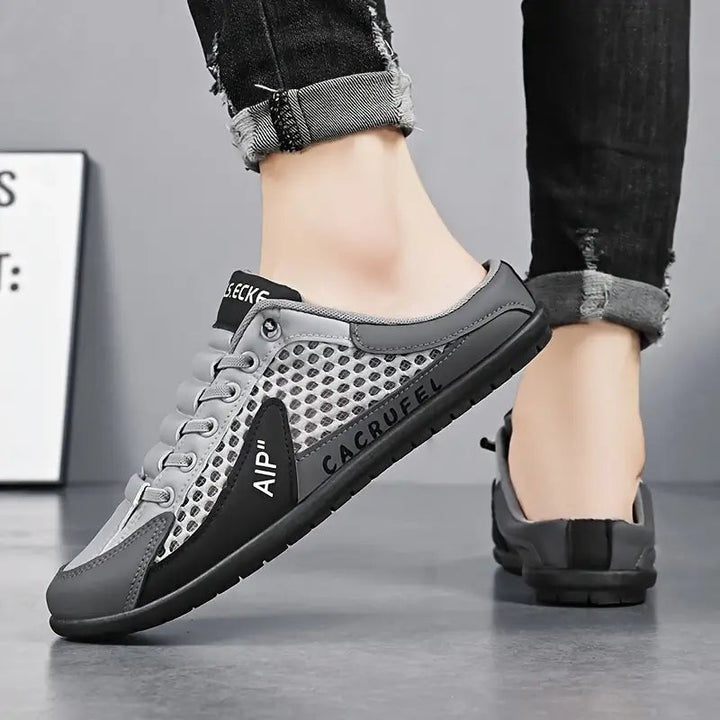 Casual men's open-back mule trainers, perfect for easy slip-on wear and relaxed everyday comfort.