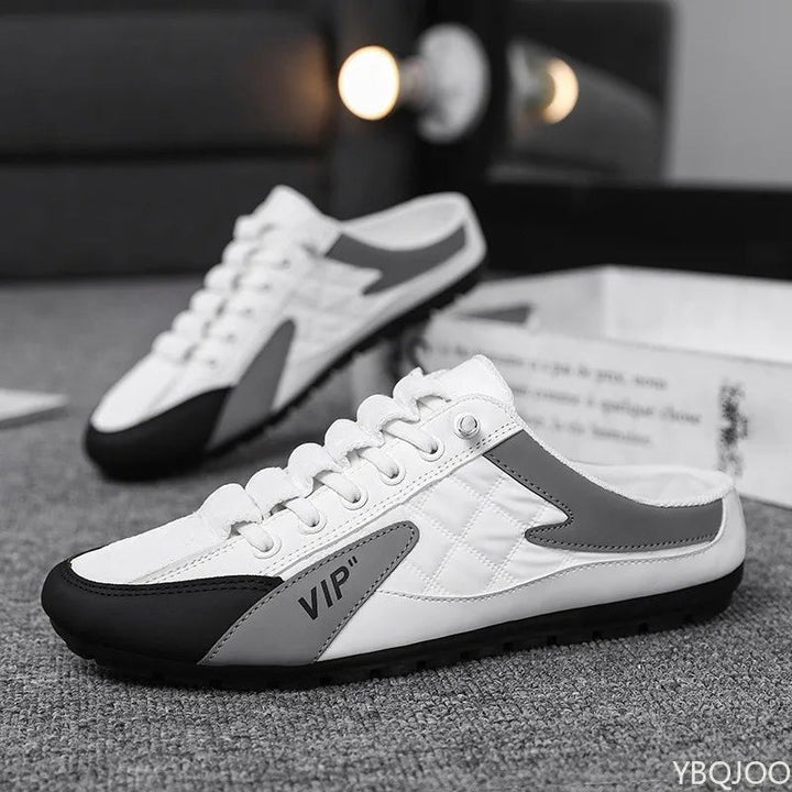 Comfortable men's backless slip-on mules, blending sporty trainer style with the ease of an open-back shoe.