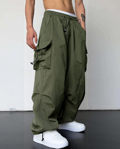 Men's comfortable wide leg baggy cargo pants with large utility pockets. Perfect for streetwear style.