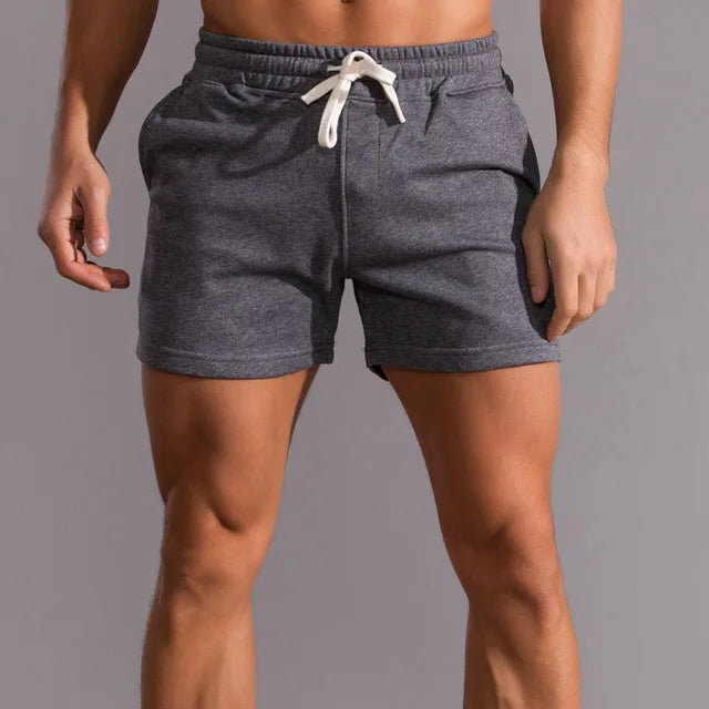 Man wearing comfortable blue casual summer shorts. Relaxed fit ideal for outdoor, everyday & versatile styling.