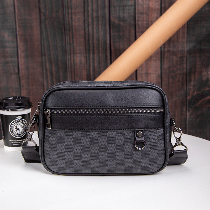 Men's black checked leather crossbody messenger bag for daily commute & travel. Adjustable shoulder strap, sleek design.