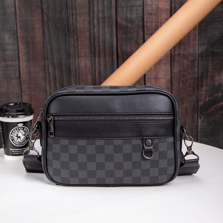 Men's black checked leather crossbody messenger bag for daily commute & travel. Adjustable shoulder strap, sleek design.