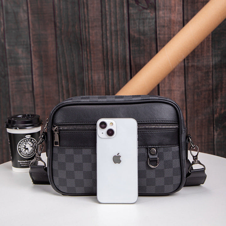 Stylish men's checked leather shoulder bag, perfect for travel or daily commute. Practical crossbody messenger.
