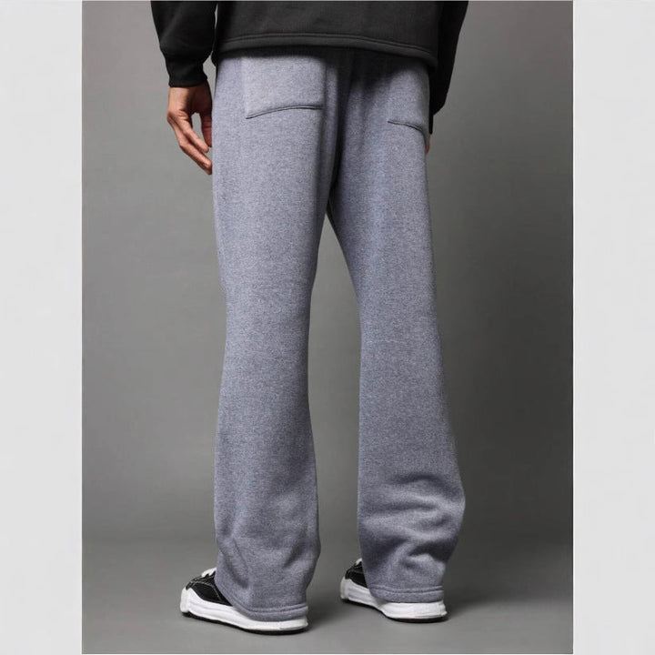 Men's stylish flared sweatpants in black, grey, purple. Relaxed fit, drawstring, comfortable casual wear.