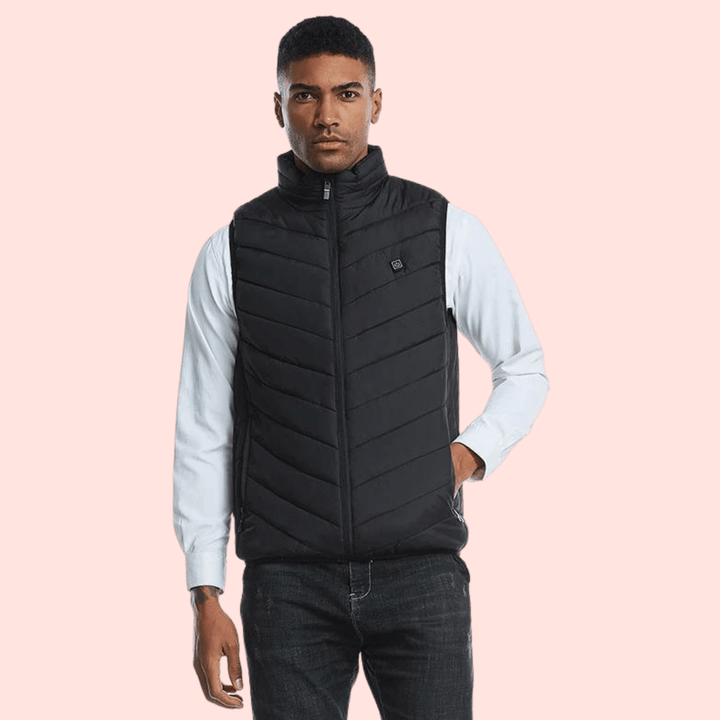 Man hiking in a lightweight men's heated gilet, active wear body warmer perfect for outdoor winter adventures.
