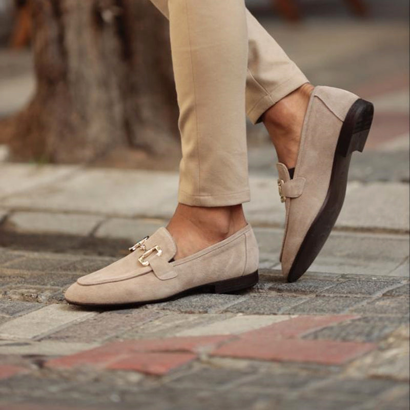 Versatile men's beige horsebit loafers; comfortable slip-on shoes for both formal and casual outfits.