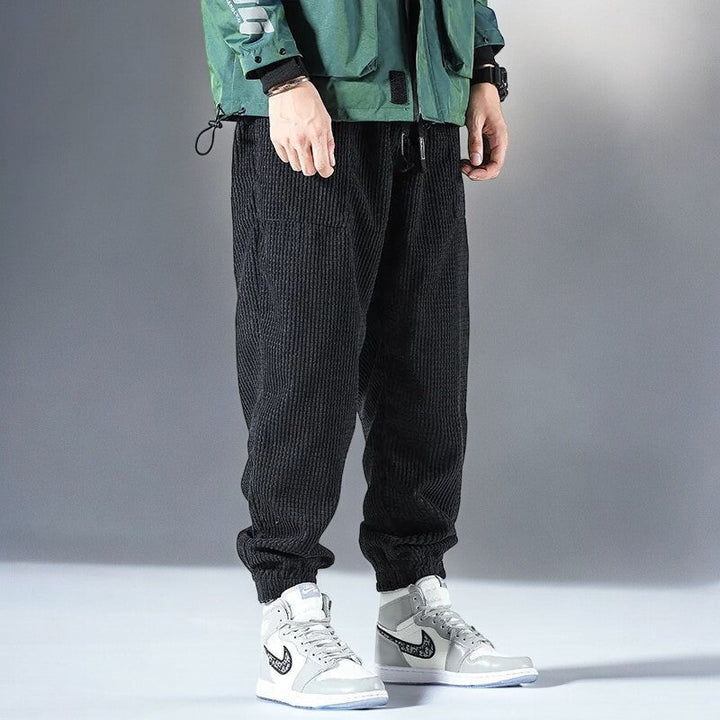Versatile men's Japanese casual sweatpants, blending comfort with a modern relaxed fit for lounge and streetwear.