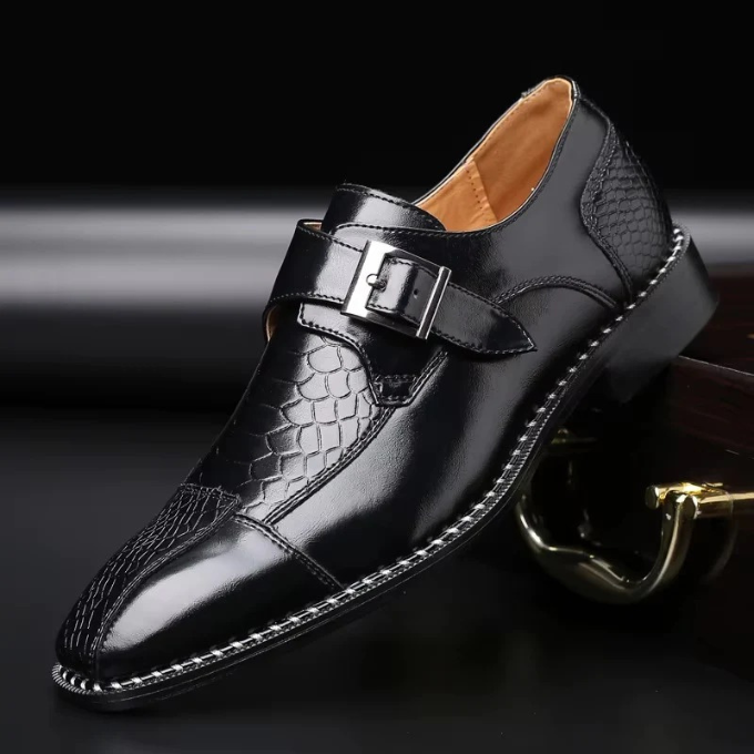 Side view of a men's polished leather monk strap shoe, showcasing the stylish buckle detail & craftsmanship.