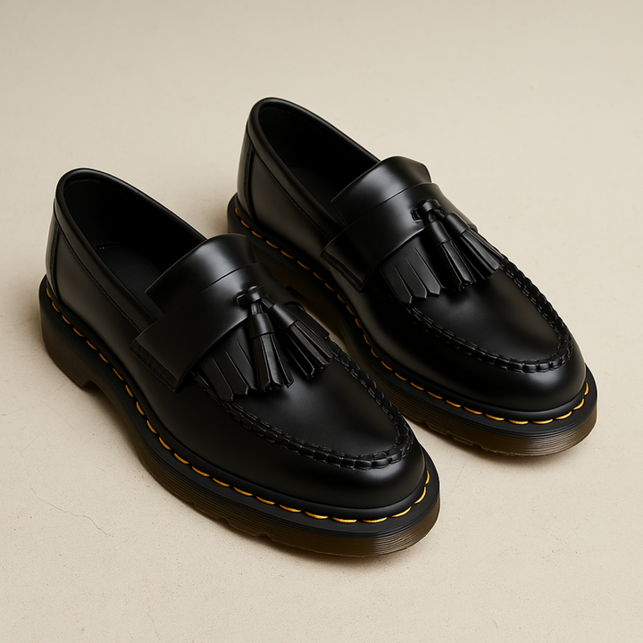 Stylish men's tassel loafers in dark brown, versatile slip-on footwear offering sophisticated comfort for any occasion.